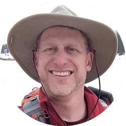 Profile photo of Shea Oliver in a hiking hat