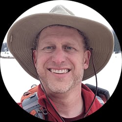 Profile photo of Shea Oliver in a hiking hat